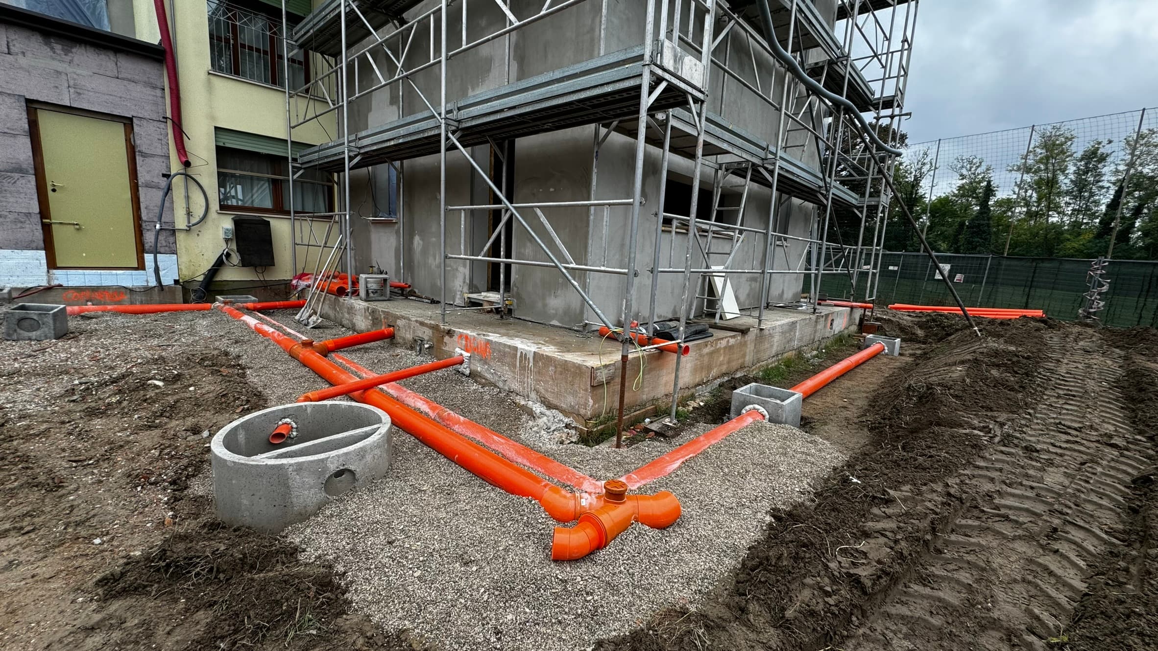 Close up on excavator bucket moving earth